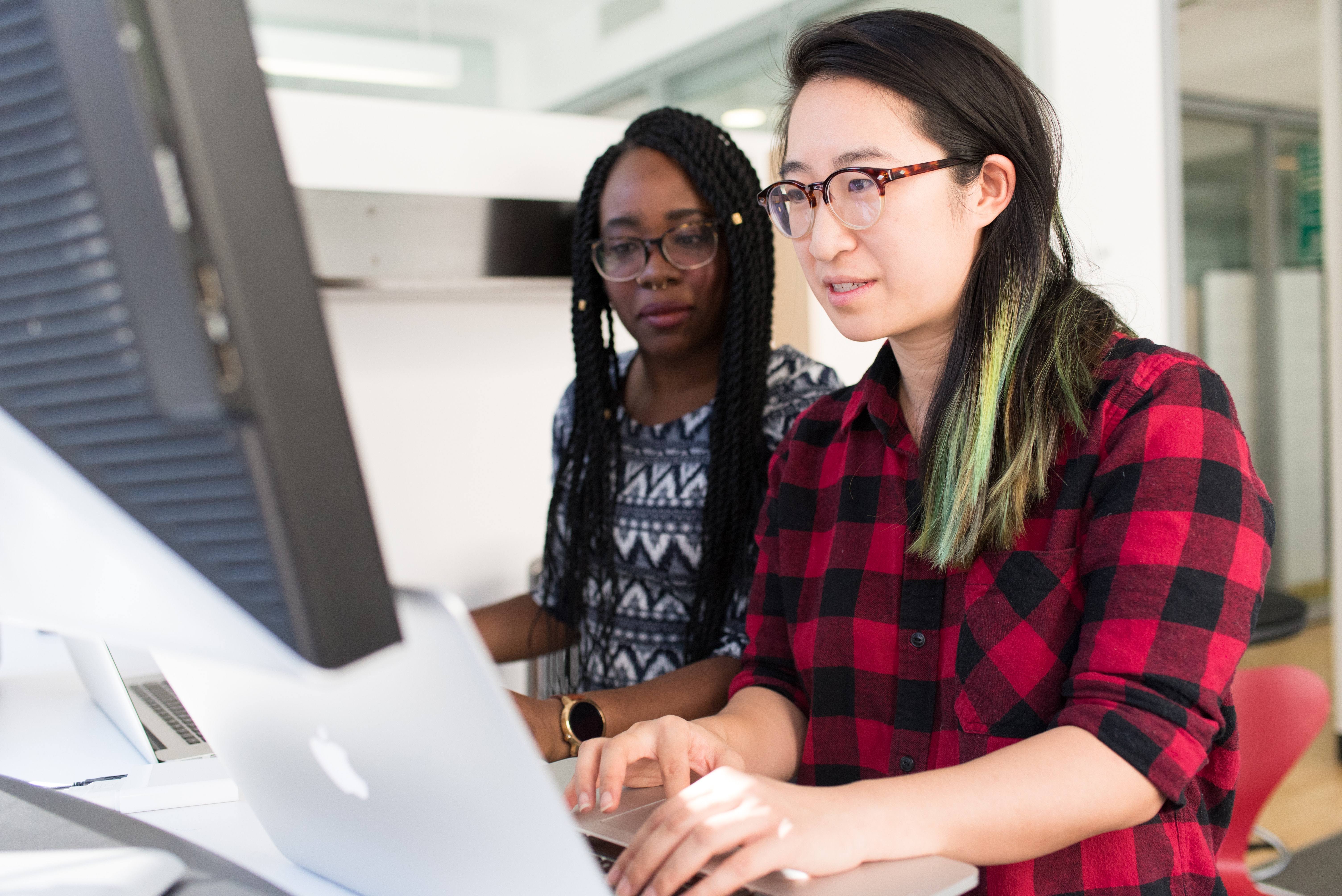 Two females coding